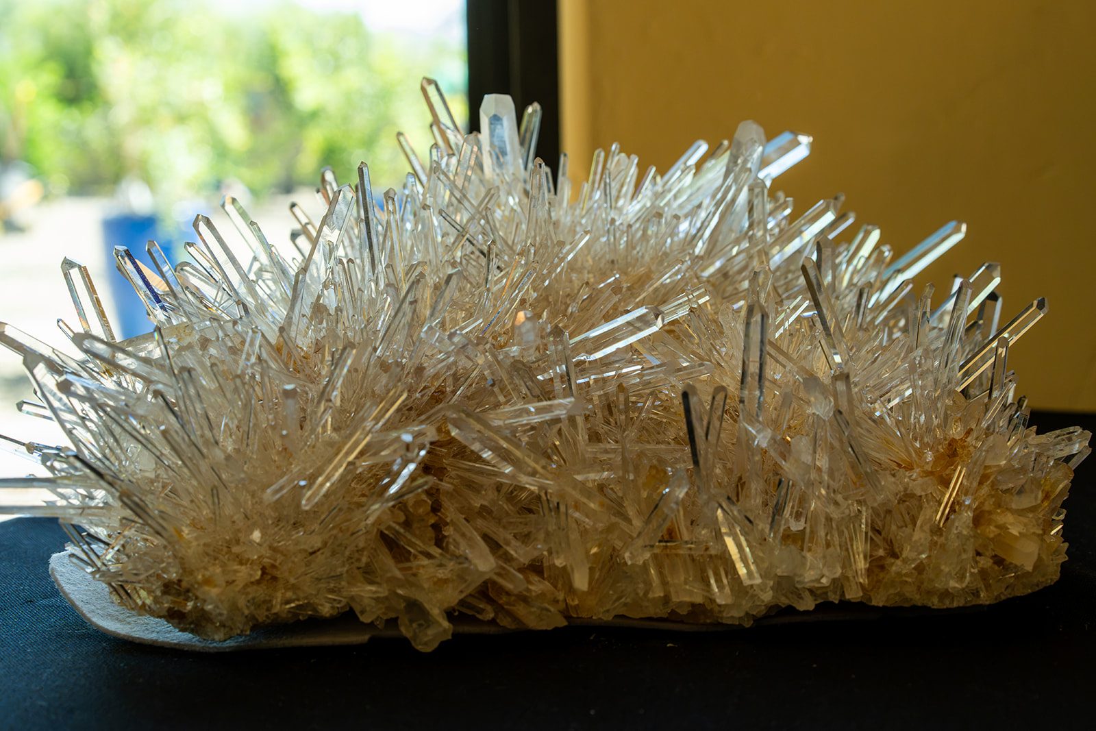 A clear quartz cluster in window light
